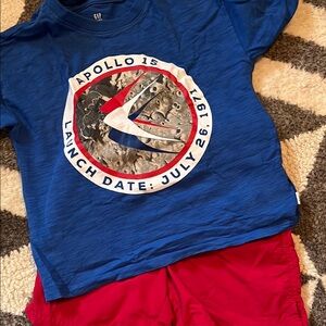 GAP Apollo/NASA shirt with red shorts and Superman shirt, size 4.